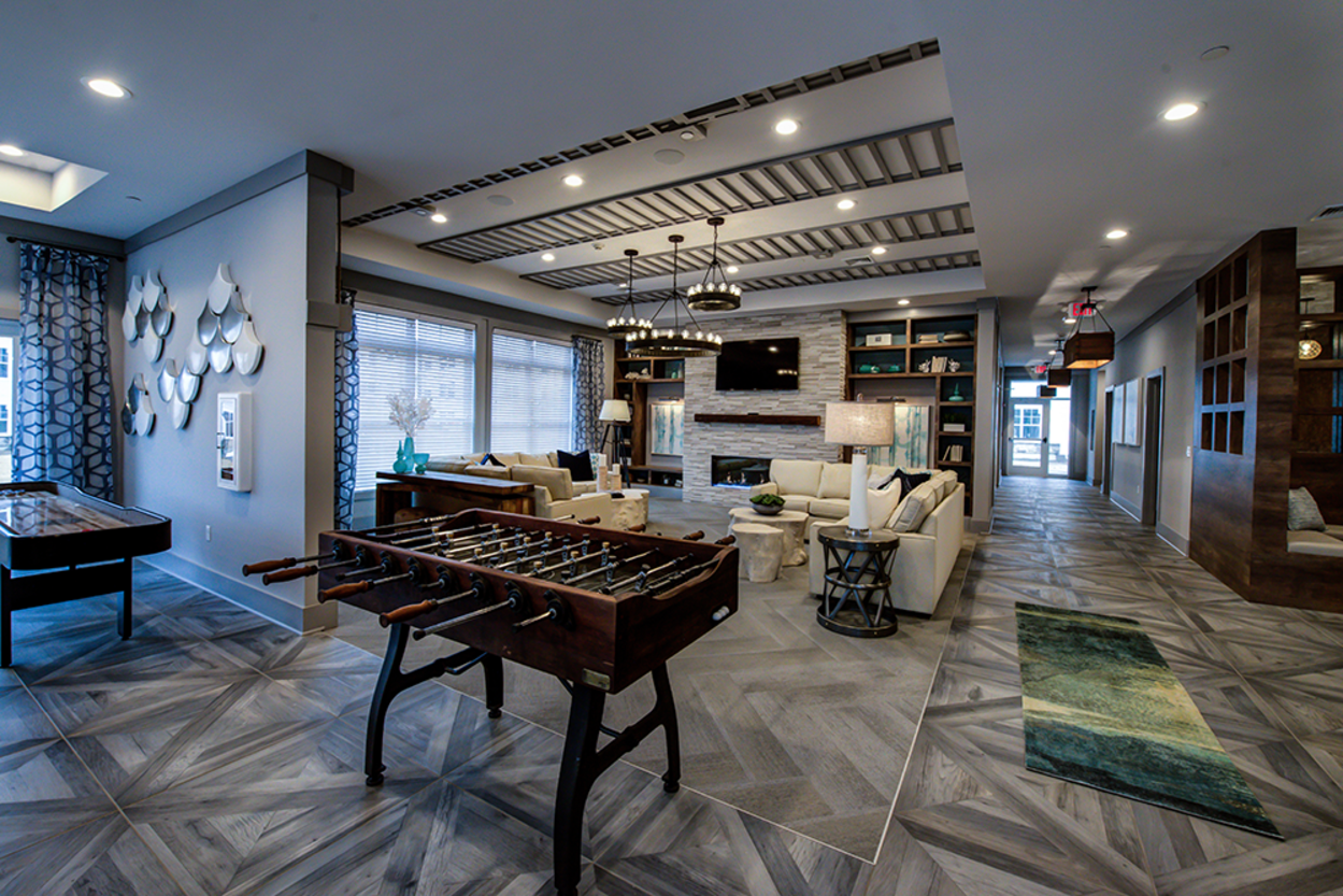 There is a foosball table in the middle of the room.