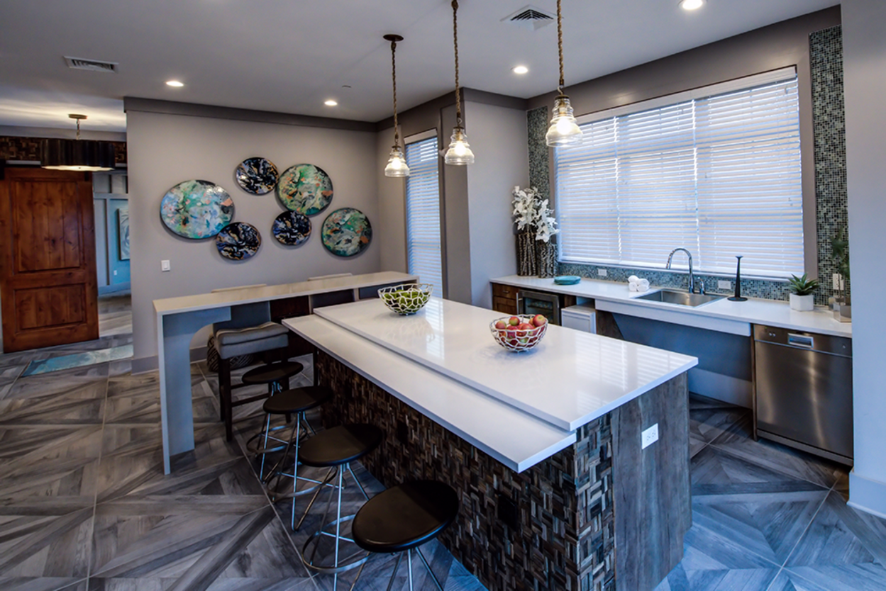 There is a large island in the middle of the kitchen.