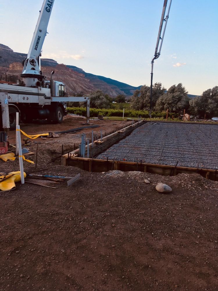 Concrete being poured on a construction site.