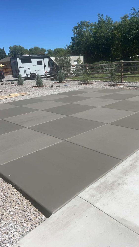 Newly poured square concrete driveway.