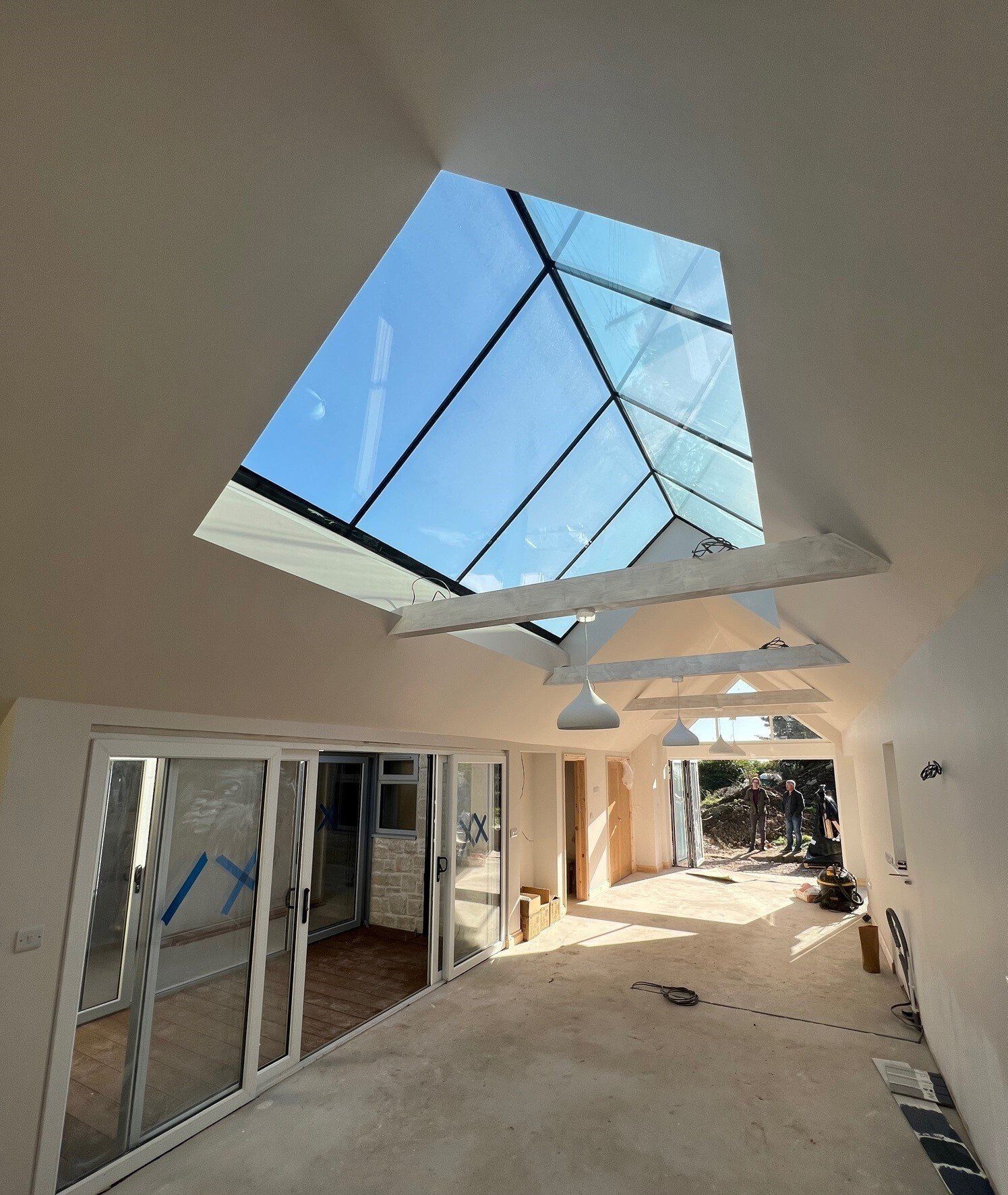 Esdon Architecture. New Build Tisbury, Wiltshire, internal view out of roof lights. Esdon Architecture. Wiltshire and Hampshire Architect. Tisbury new build. Chalet bungalow. Local Stone. Architectural Glazing. Courtyard. Internal view. Planning drawings, planning application, planning permission.