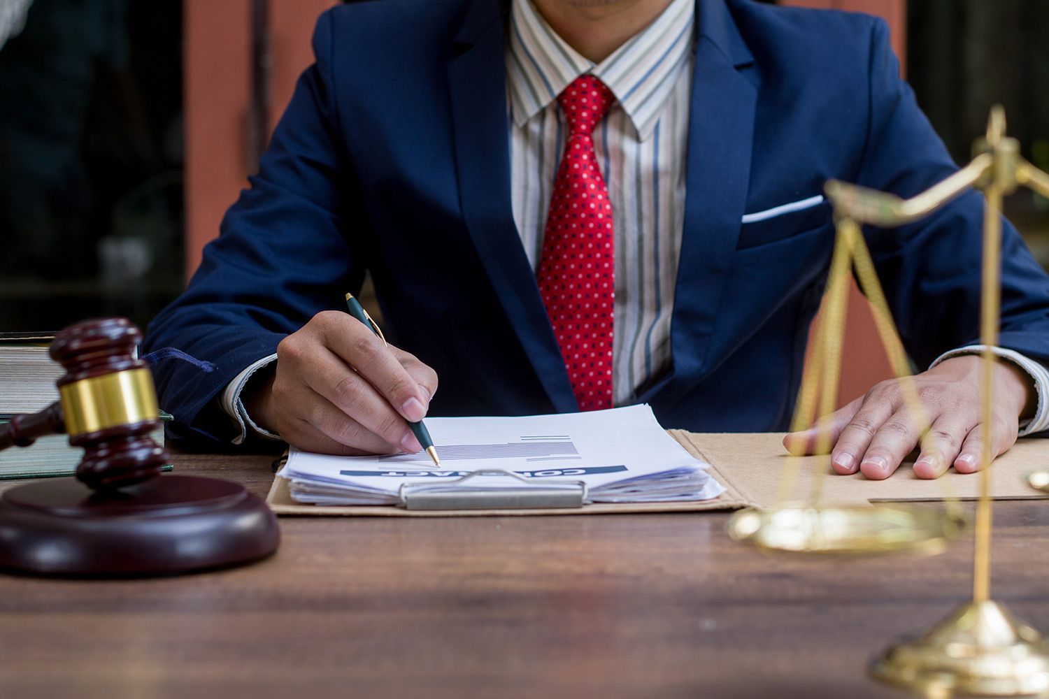Lawyer Checking Contracts — Fort Myers, FL — Lynn Law Group