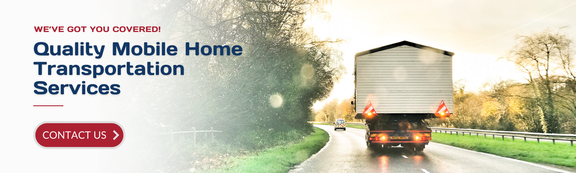 A mobile home being transported by truck on a road, with text: 