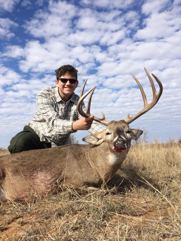 Men with the deer they harvested on a Salt Fork Hunt at Henard Ranch