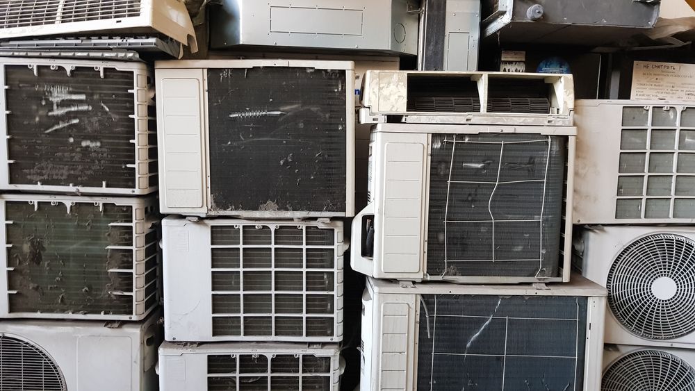 A Pile Of Old Air Conditioners Are Stacked On Top Of Each Other — East Coast Metal Recycling In Tugun, QLD