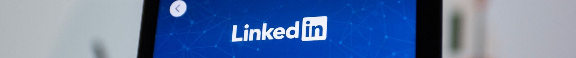 A close up of a cell phone screen with the linkedin logo on it.