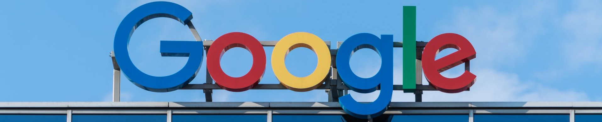 A google logo is displayed on top of a building