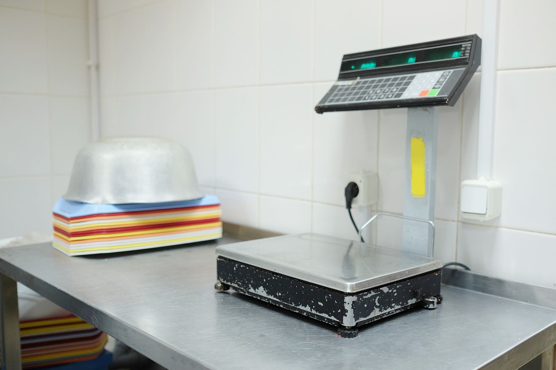 Commercial kitchen scale on stainless counter Commercial kitchen scale on stainless counter