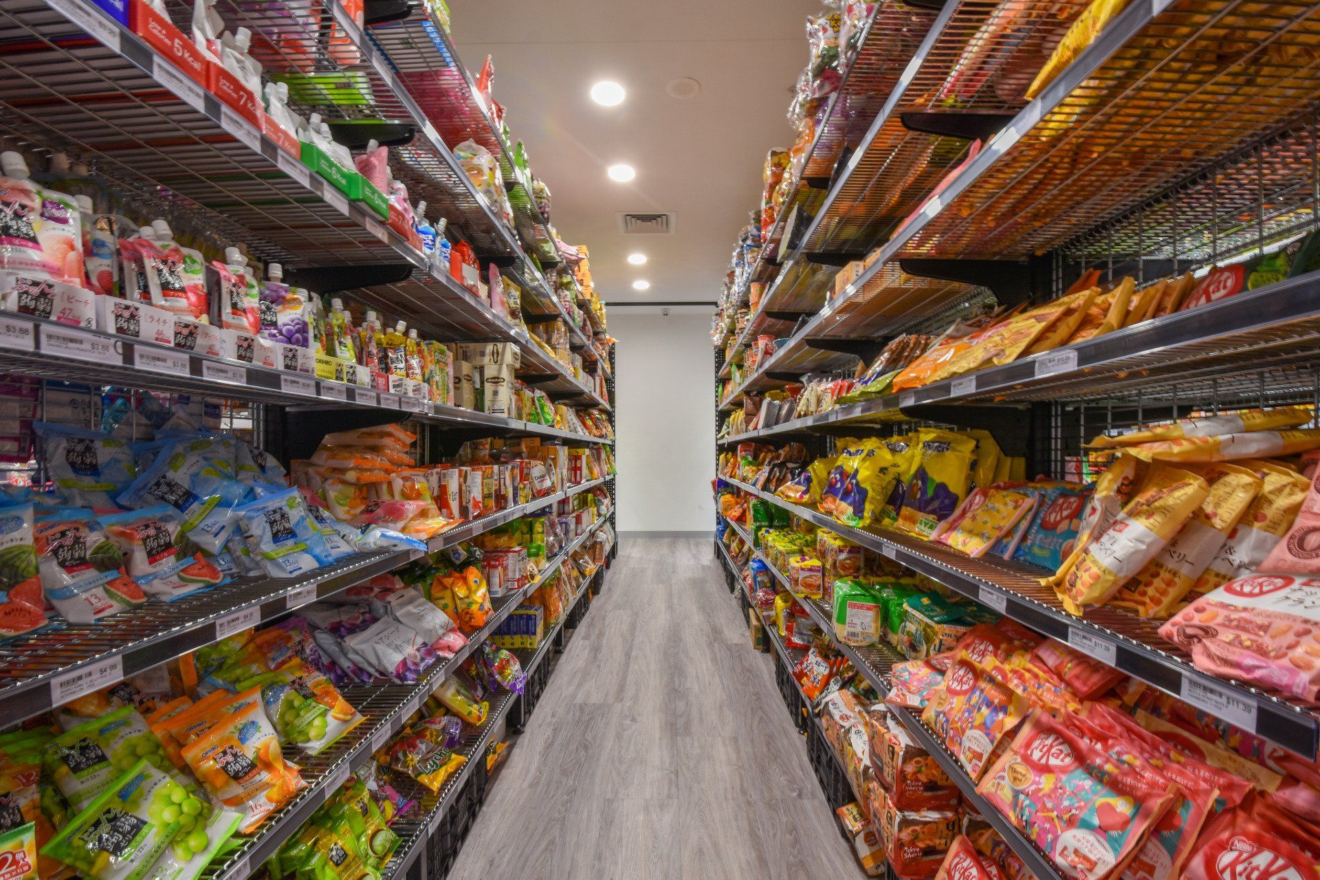 Shelves stocked with colorful packaged snacks inside a store.