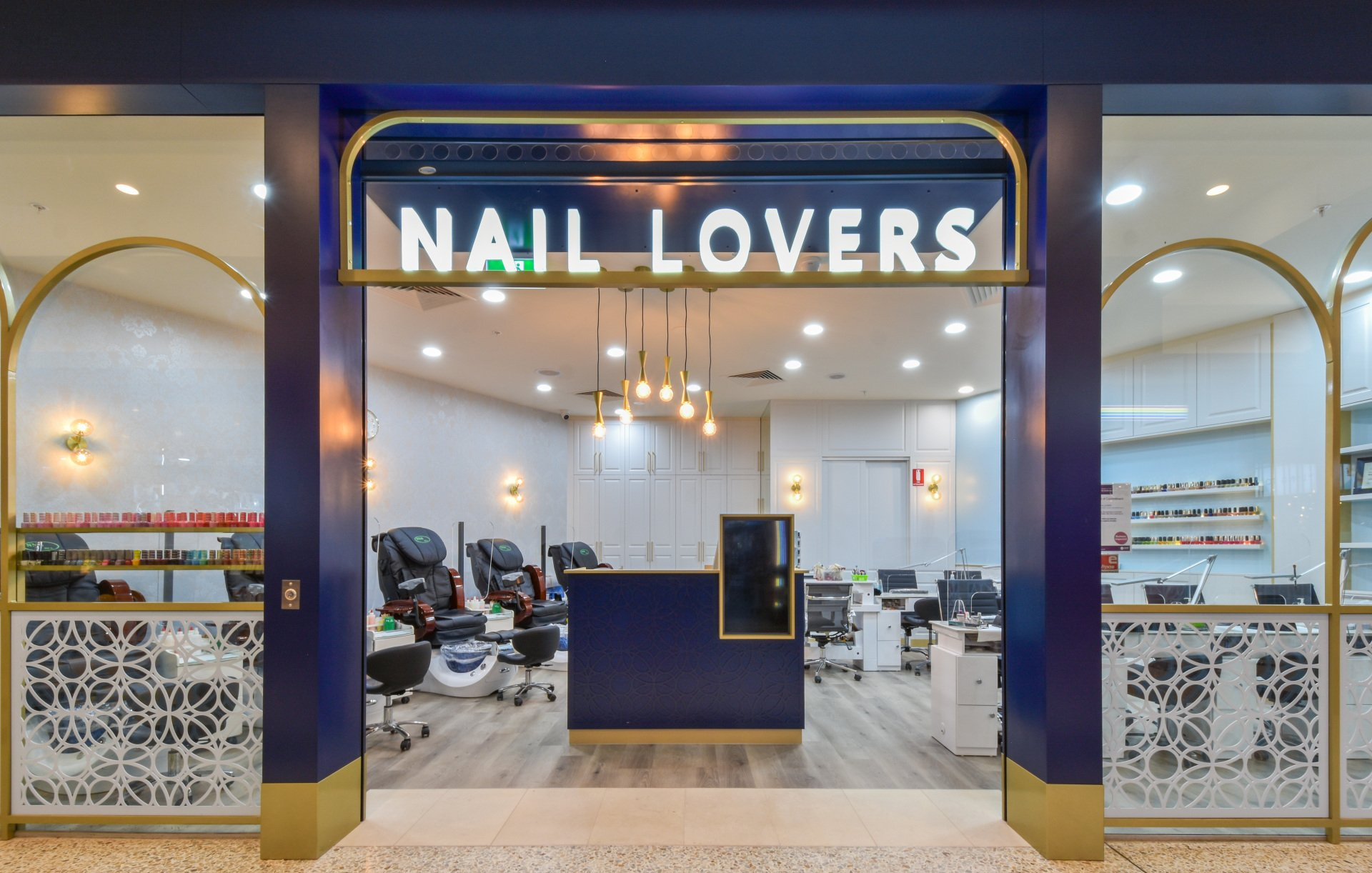 Nail salon entrance: blue and gold trim,