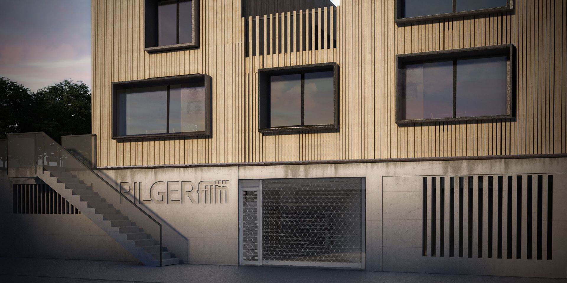 Modern apartment building facade with balconies, stairs, and a gated entrance at dusk