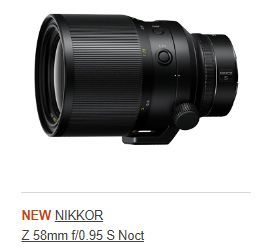A picture of a nikkor z 58mm f / 0.95 s noct lens, lying on it's side facing to the left on a white background.