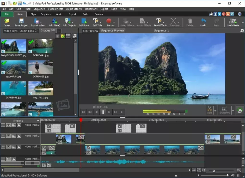 A computer screen shows the VideoPad software interface, which shows a picture of a beach and forest covered mountains on it. There is a small boat in the bottom righthand corner of the image.