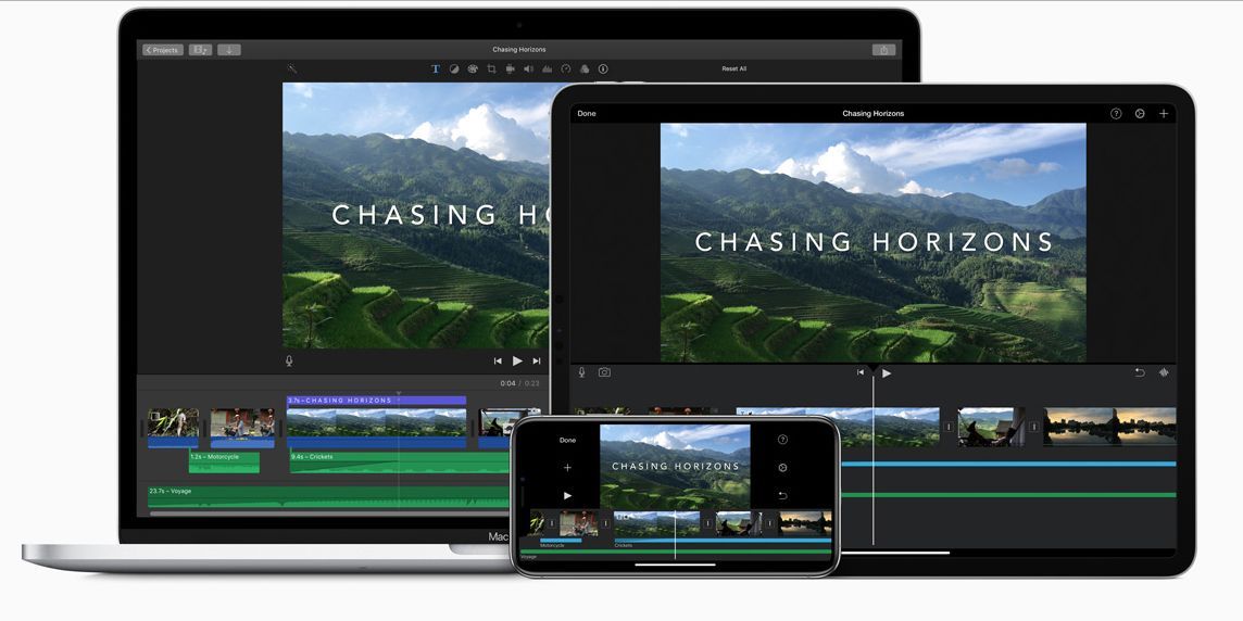 A laptop , tablet , and phone are displaying the interface for iMovie, which is showing a video of a verdant mountain change, with the title 