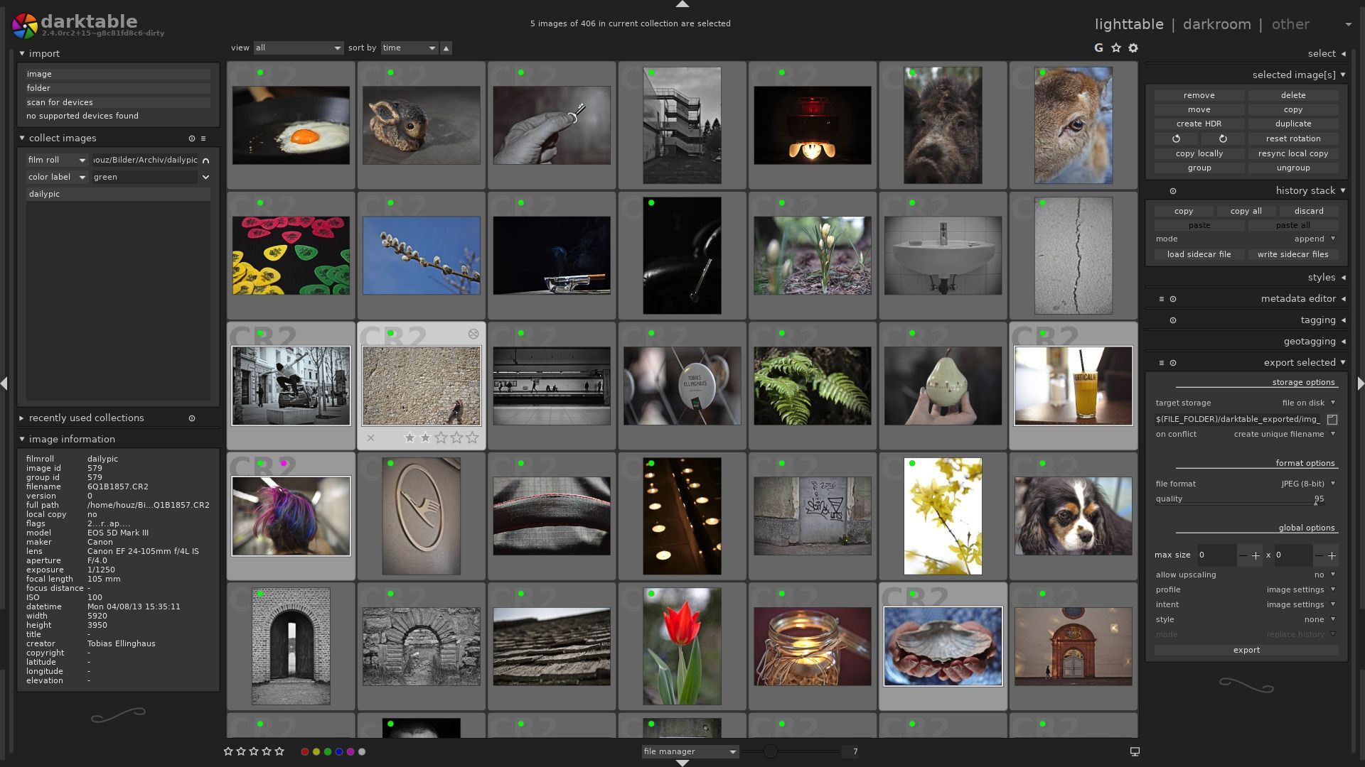 A computer screen showing the darktable software interface, with a bunch of pictures in grey frames displayed on it.