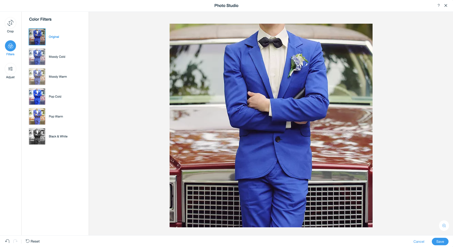 An image of the wix software interface. A man in a blue suit and bow tie is standing in front of a car.