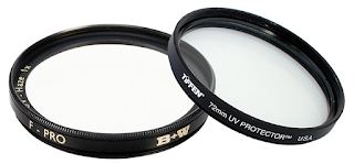 Two uv camera filters are sitting next to each other on a white background.