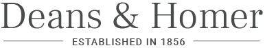 A logo for deans & homer established in 1856