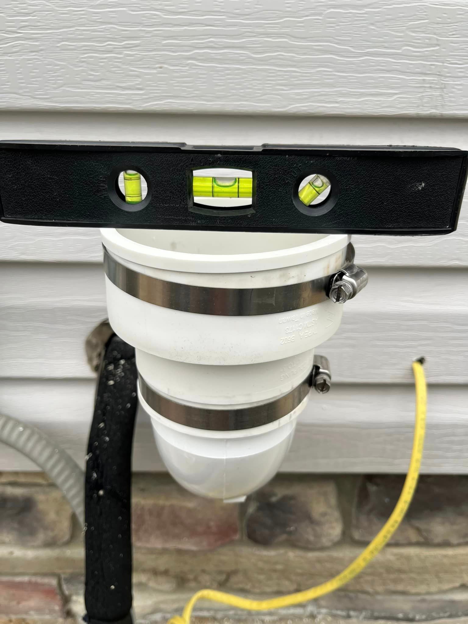 A level is being used to check the level of a pipe.