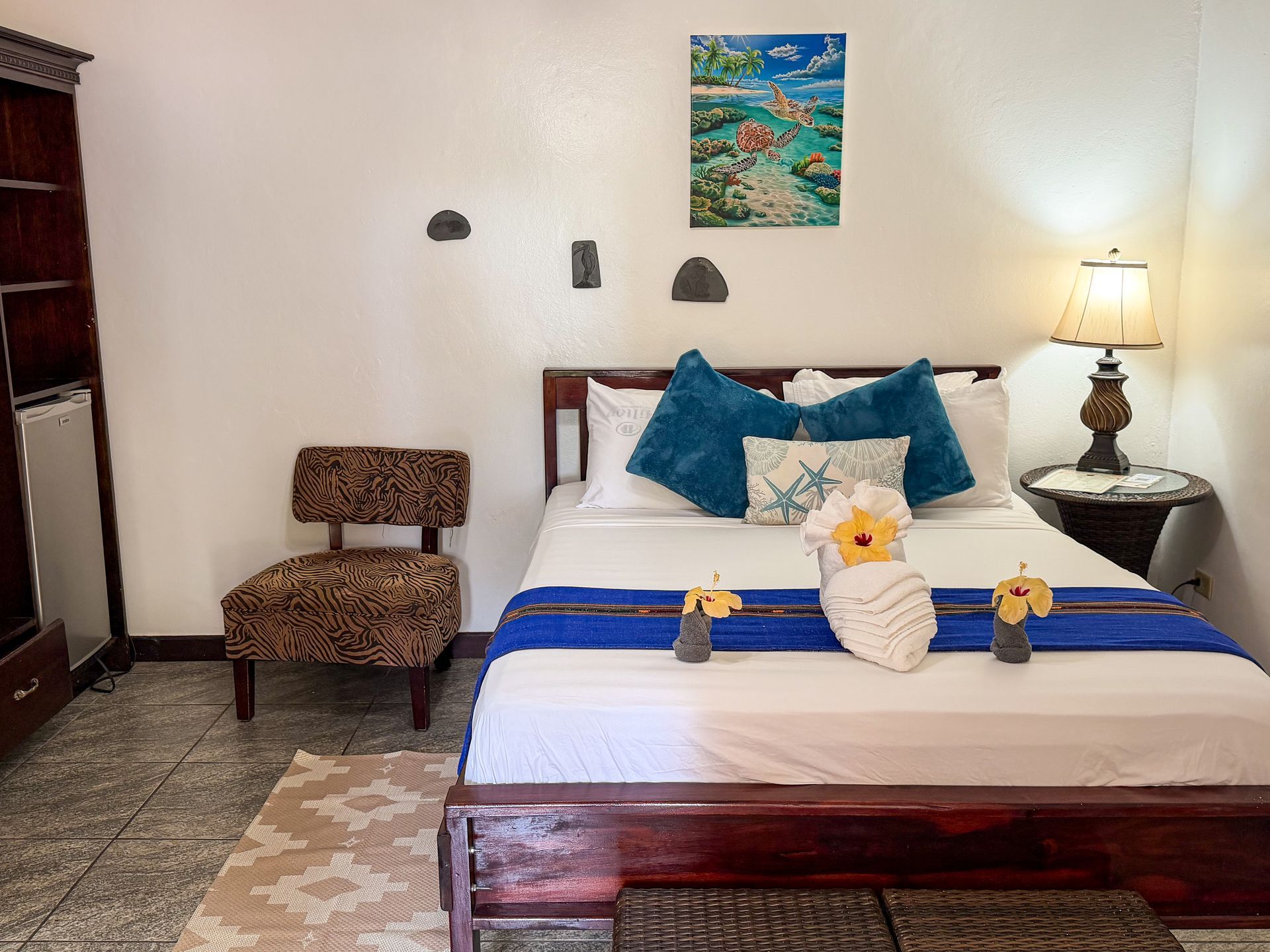 Comfortable queen-size bed in a guest room at Caribbean Shores B&B in Hopkins