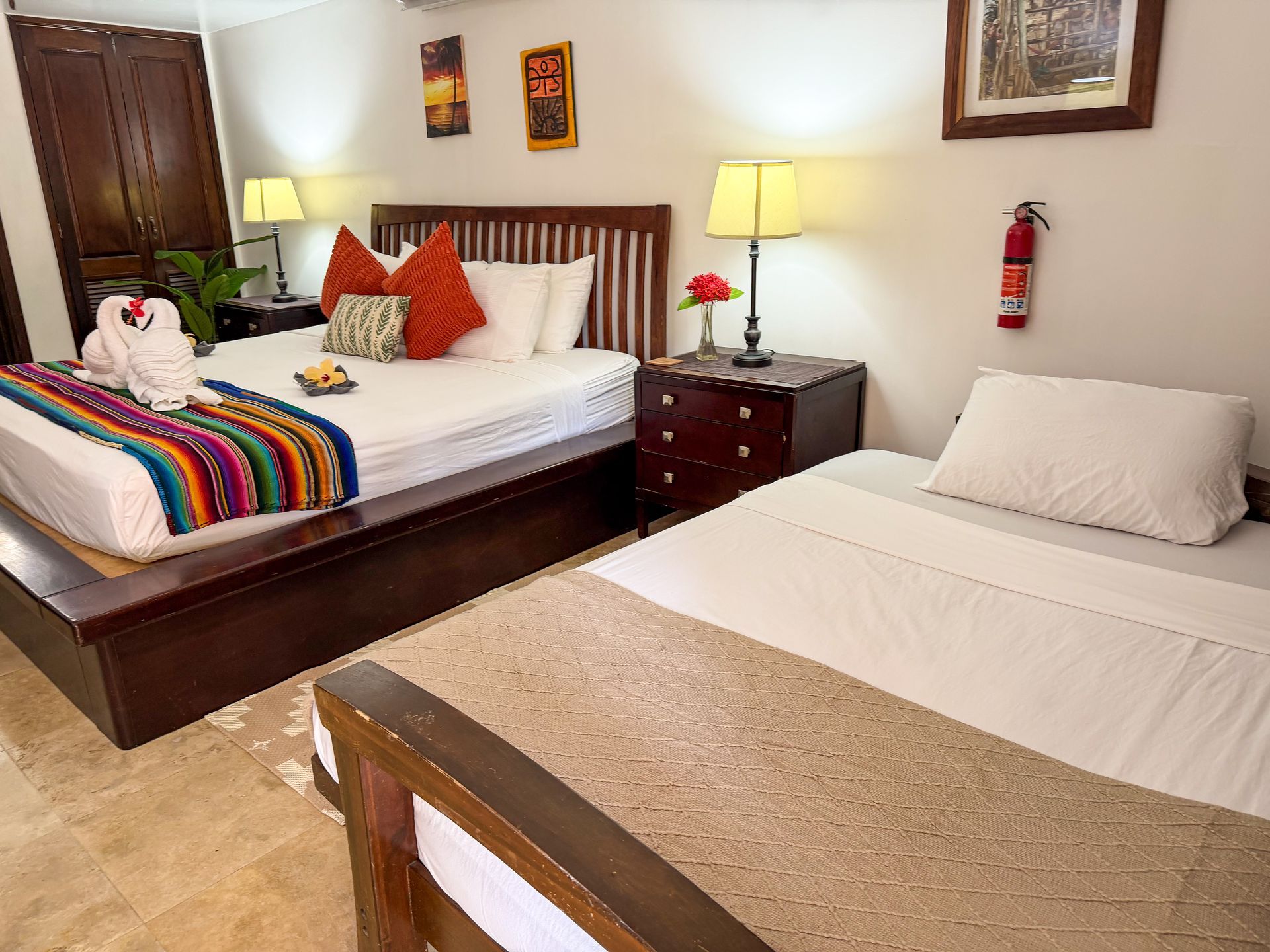 Comfortable king-size bed in a guest room at Caribbean Shores B&B Hopkins Belize