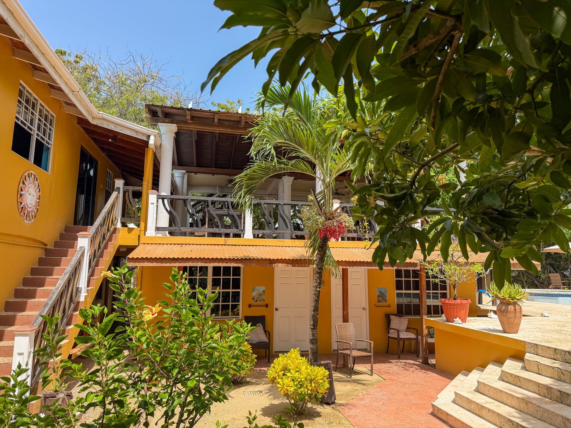 Exterior of the two-story Caribbean Shores Bed & Breakfast in Hopkins Belize