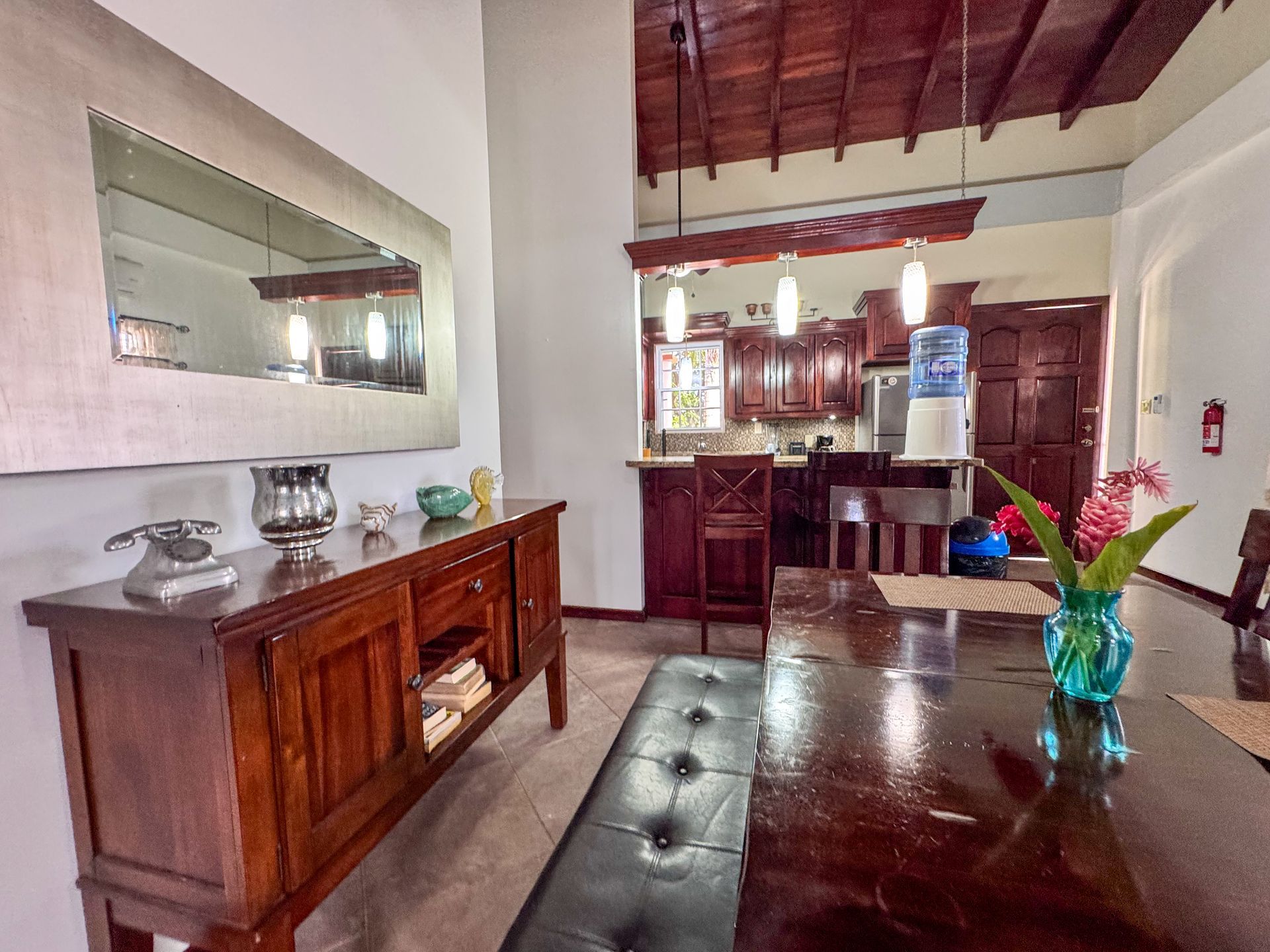 Dining area and kitchen inside a two-bedroom suite in Hopkins Village, Belize, 