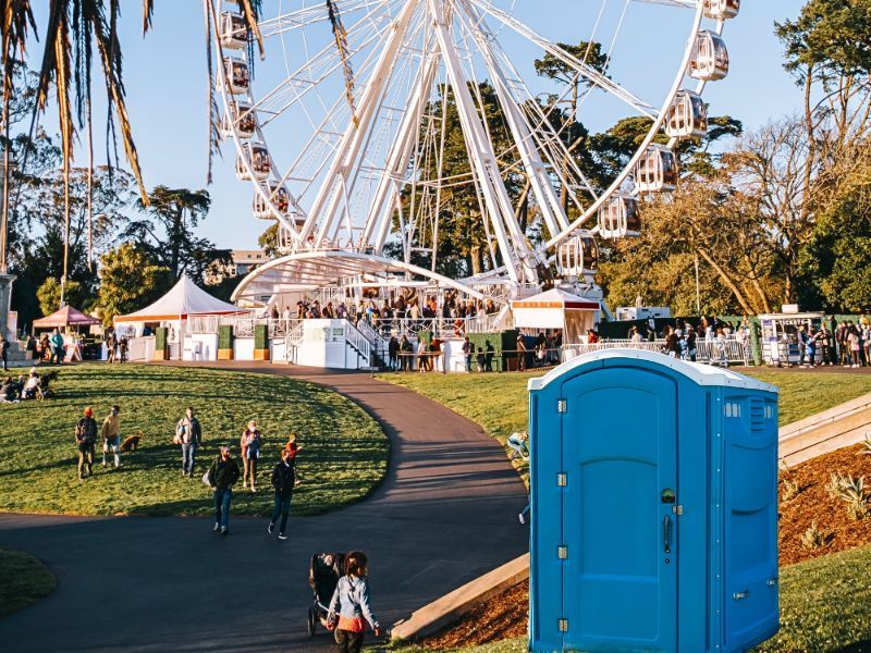 Blue Portable Restroom in Fair or Festival