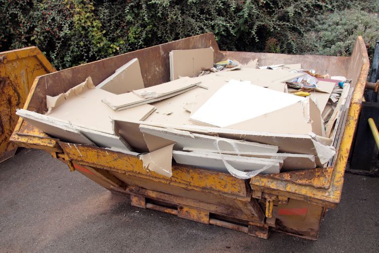 demolition debris in dumpster