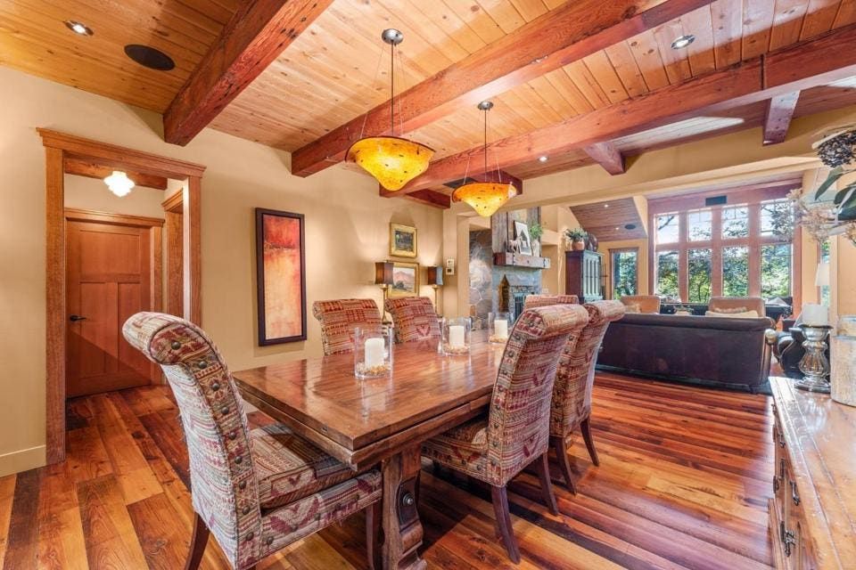 Thick wood beams top the formal rooms.