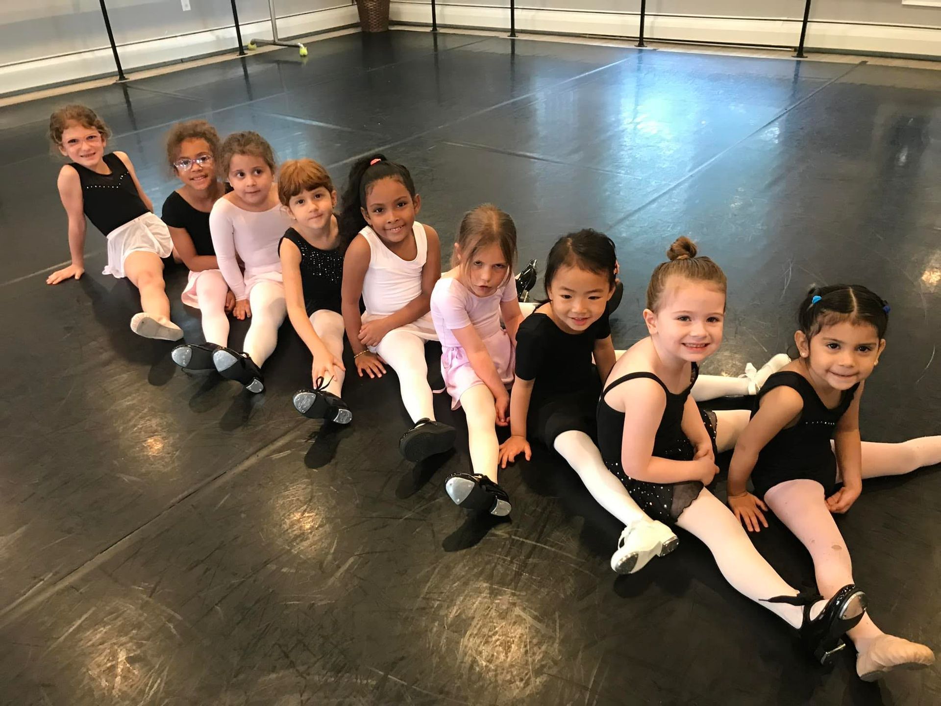 A group of young girls in a dance studio.