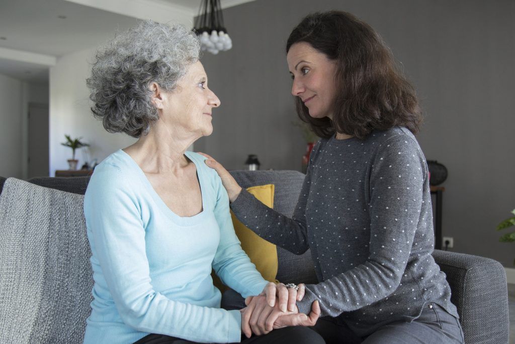Mother with Alzheimer's disease at home with her daughter.