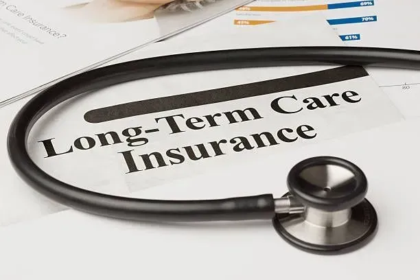 A stethoscope is sitting on top of a long-term care insurance form.