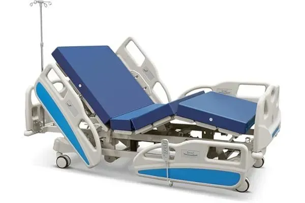 A hospital bed with a blue mattress and a white frame