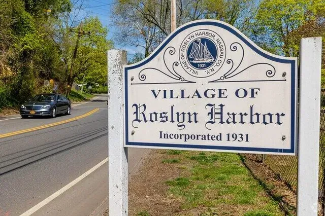A sign for the village of roslyn harbor incorporated 1931