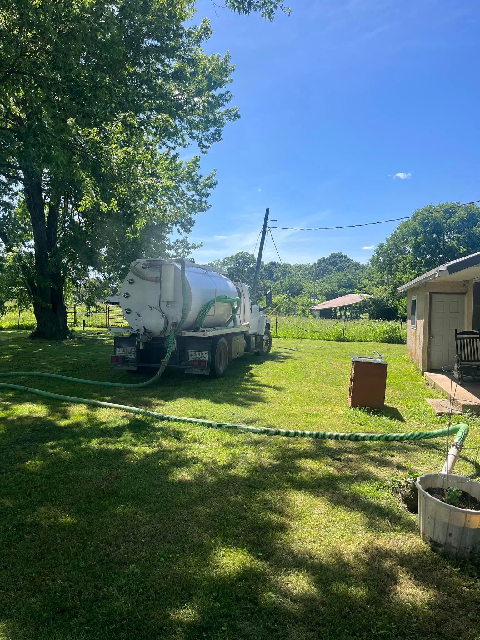Emergency Septic Pumping | Truck at a home in Mountain Grove, MO