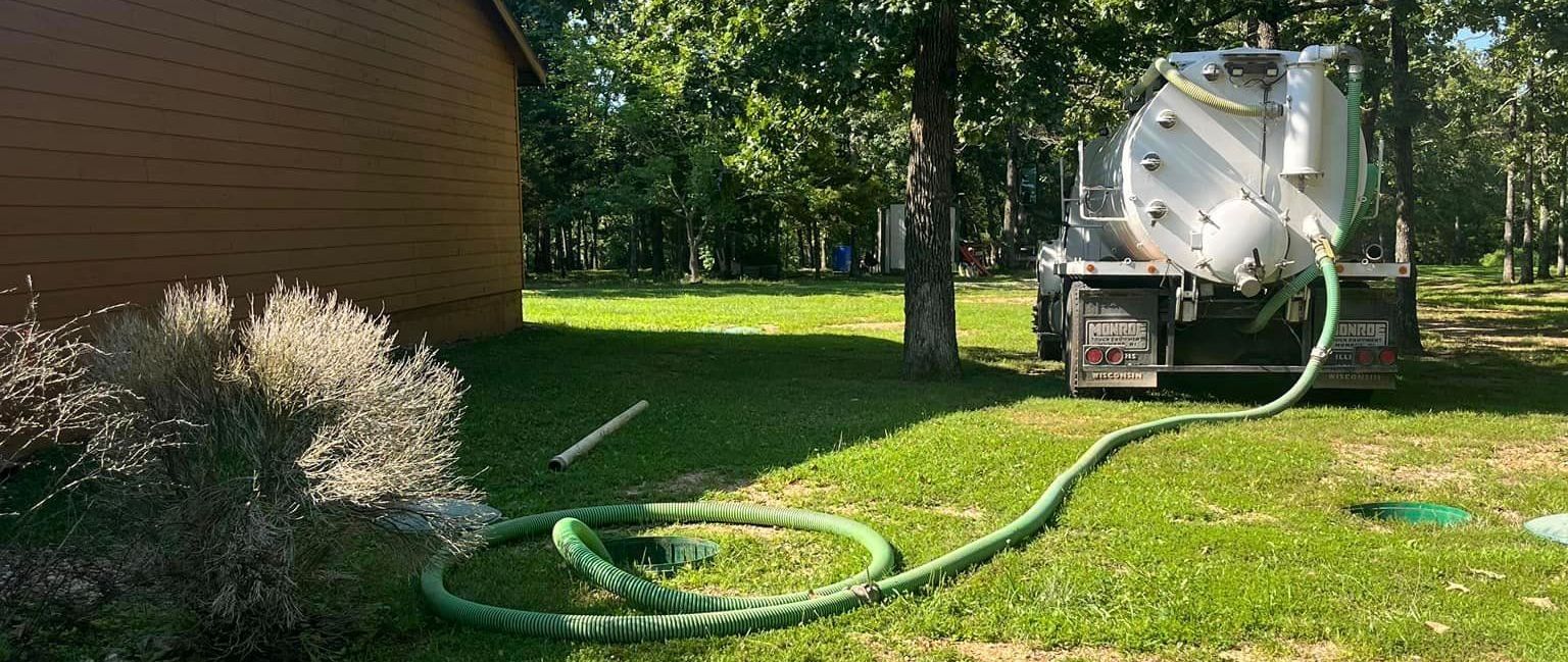 White truck providing septic tank pumping at home in Mansfield, MO