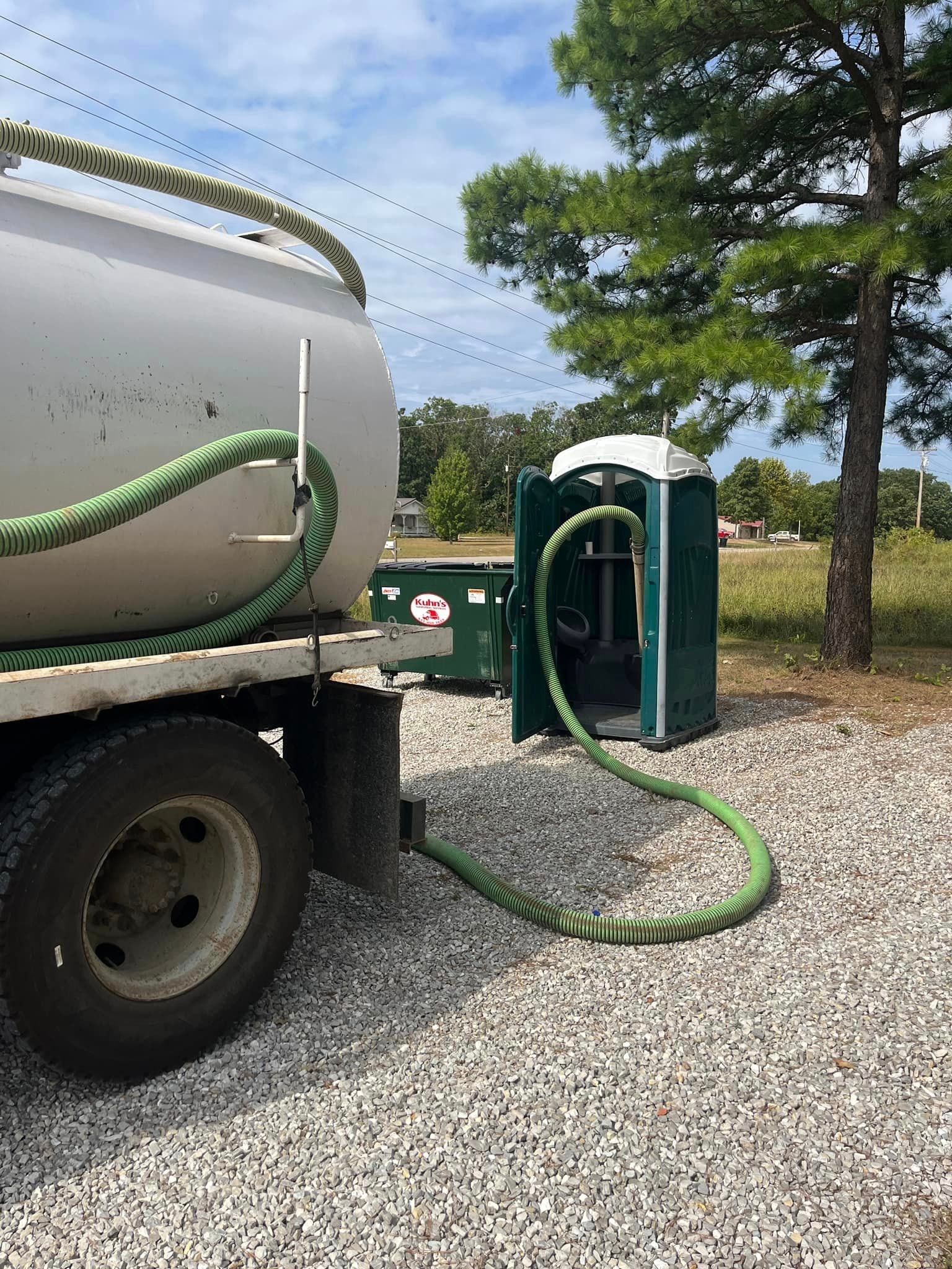 Cleaning out rental porta-potty with vacuum truck services in West Plains MO