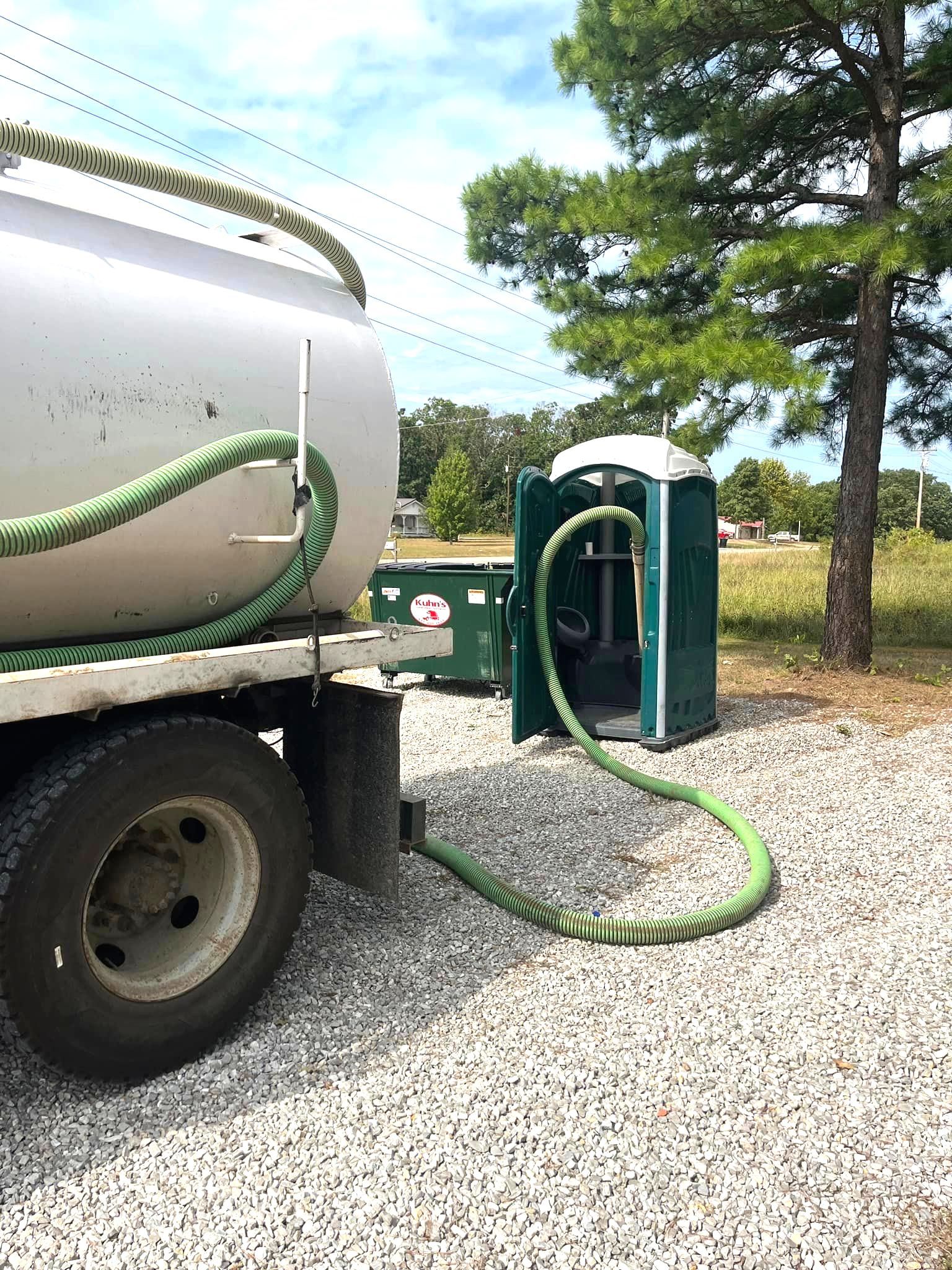 White vacuum truck cleaning out portable toilet rental | Rentals in Rolla and Marshfield, MO