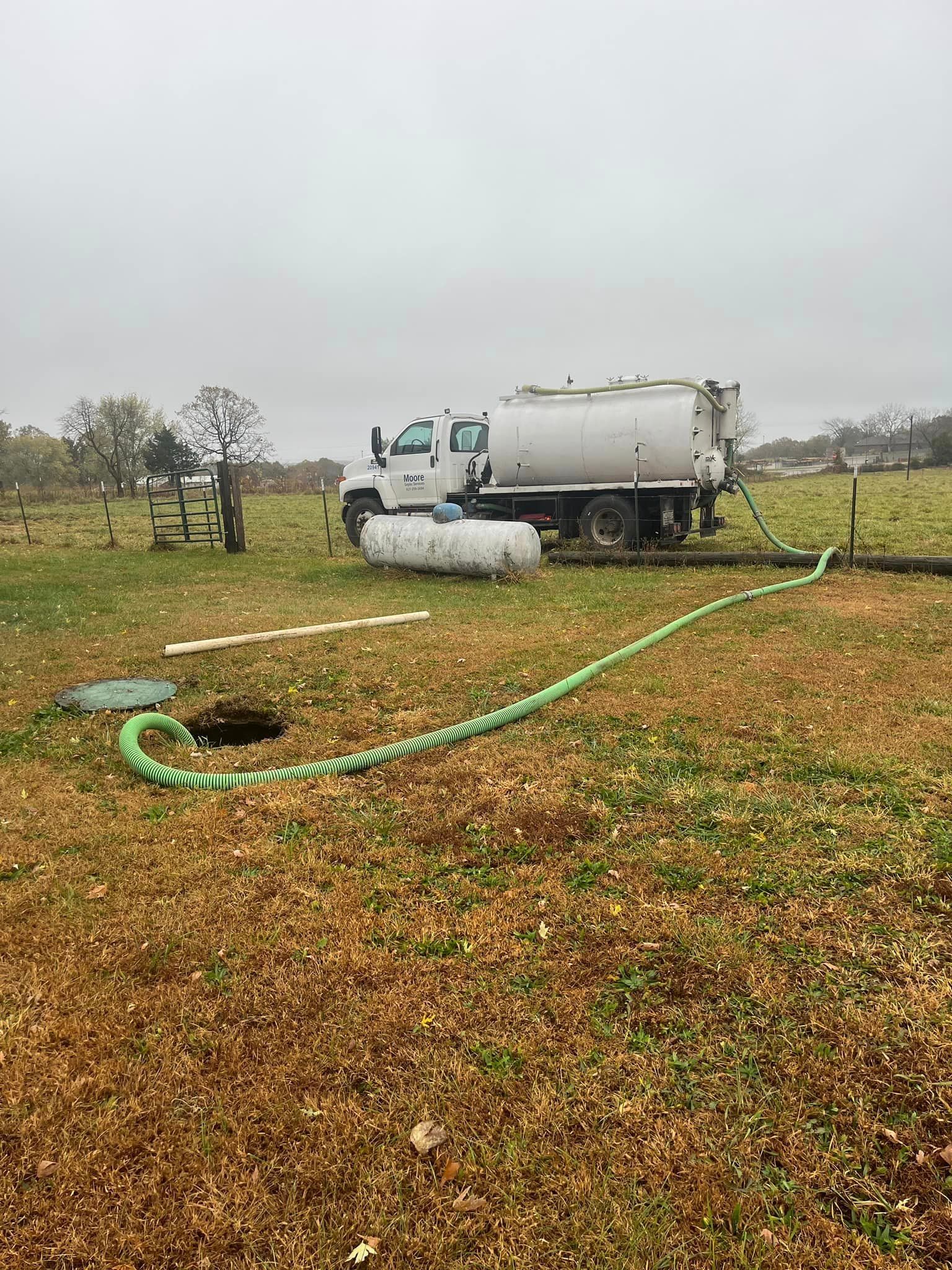 Septic truck pumping septic tank near Houston MO