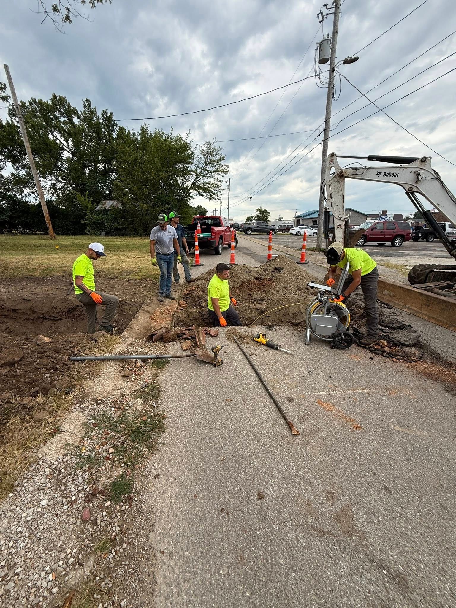 Man pointing to spill | Waste cleanup with emergency vacuum truck services near Lebanon, MO