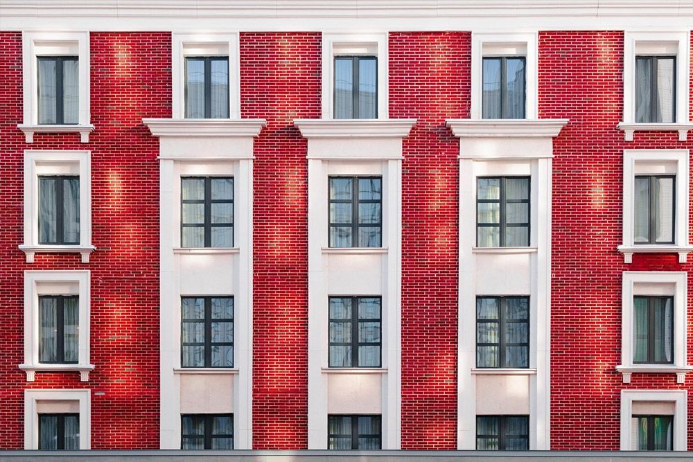 A red and white building with lots of windows