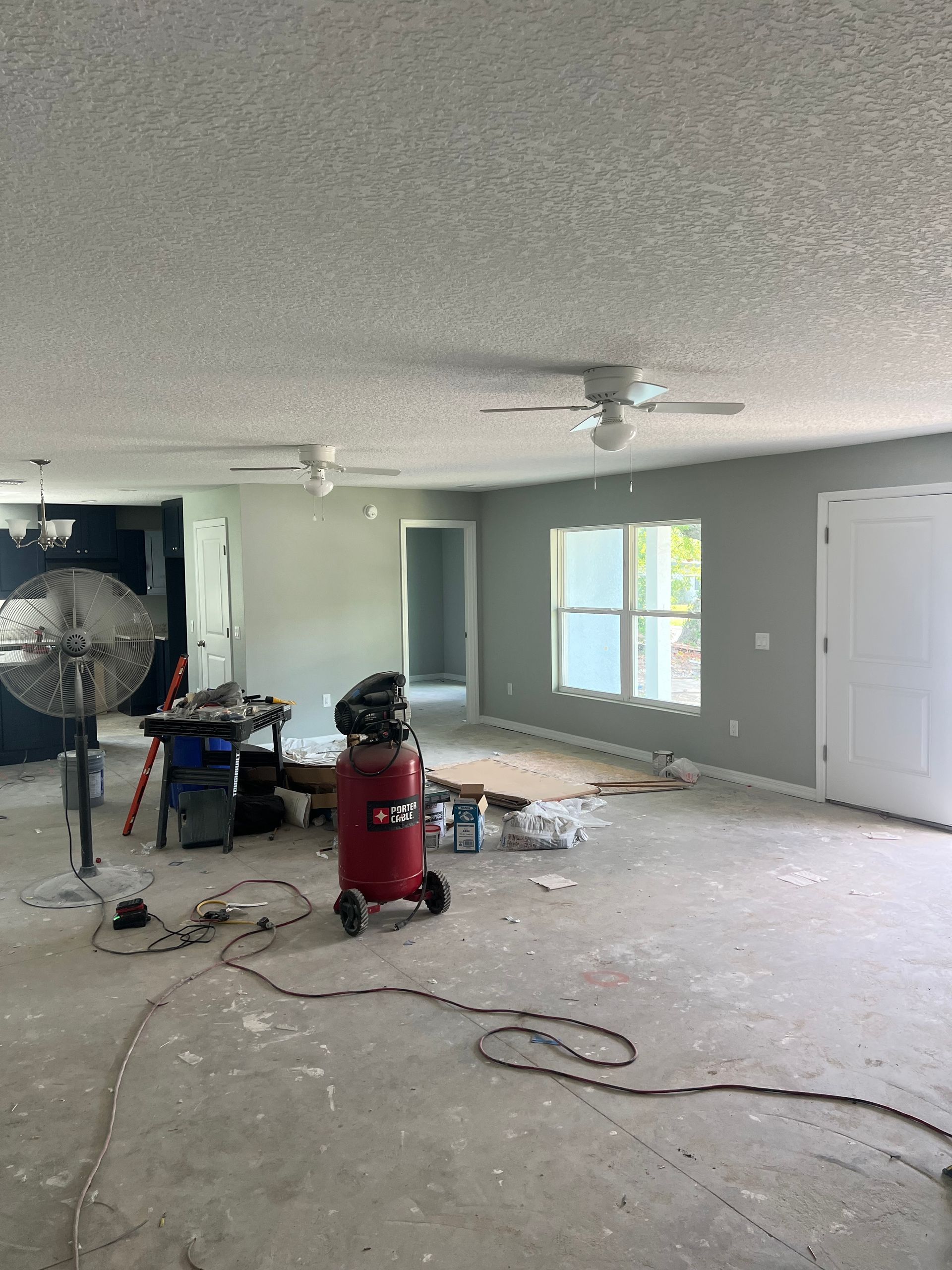 There is a vacuum cleaner in the middle of the room.