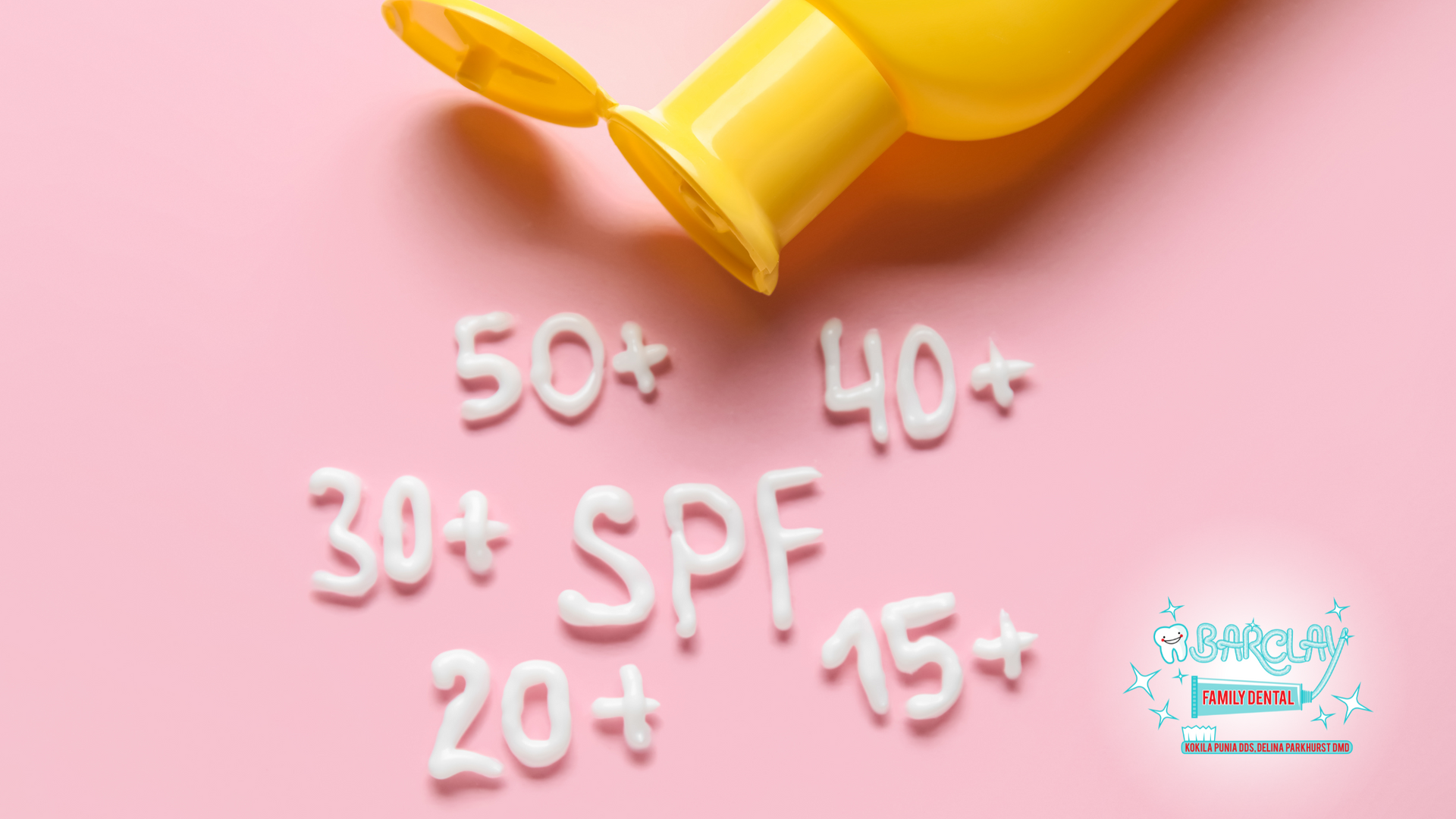 A yellow bottle of sunscreen is sitting on a pink surface.