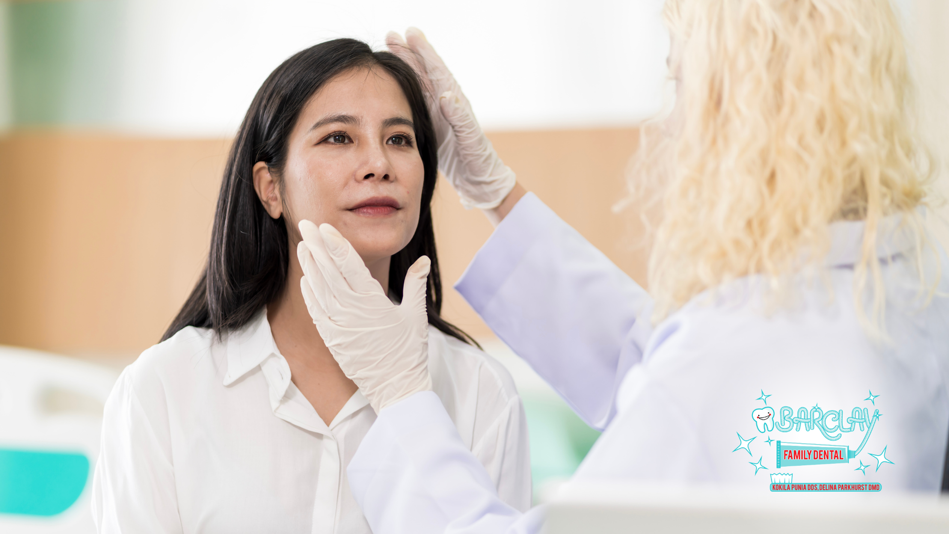 A woman is getting her face examined by a doctor.