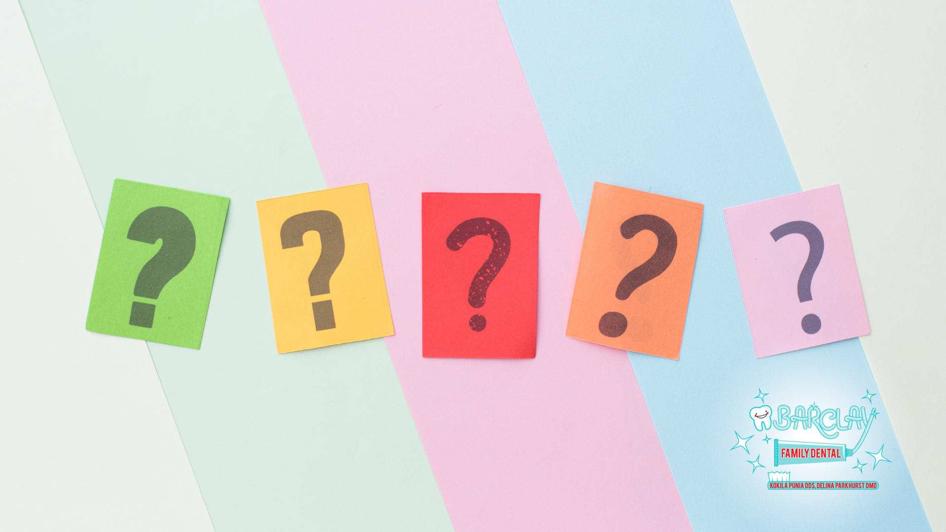 A row of colorful sticky notes with question marks on them.