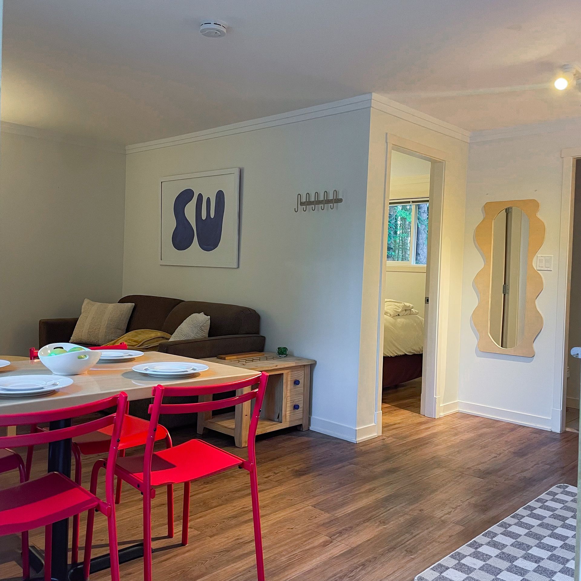 a living room with a table and chairs and a couch