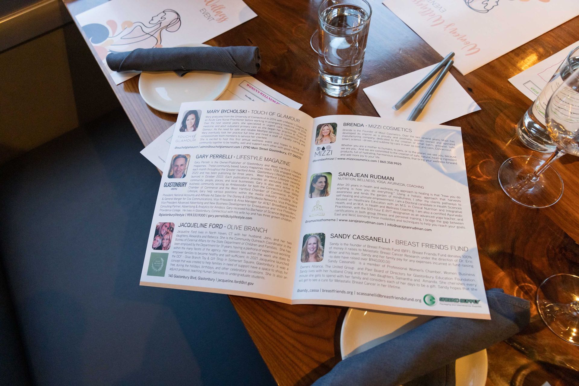 A menu is open on a wooden table.