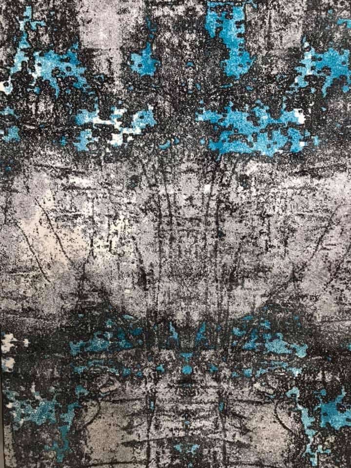 A Close Up Of A Rug With A Blue And Gray Pattern On It — Charmhaven Carpets In Charmhaven, NSW