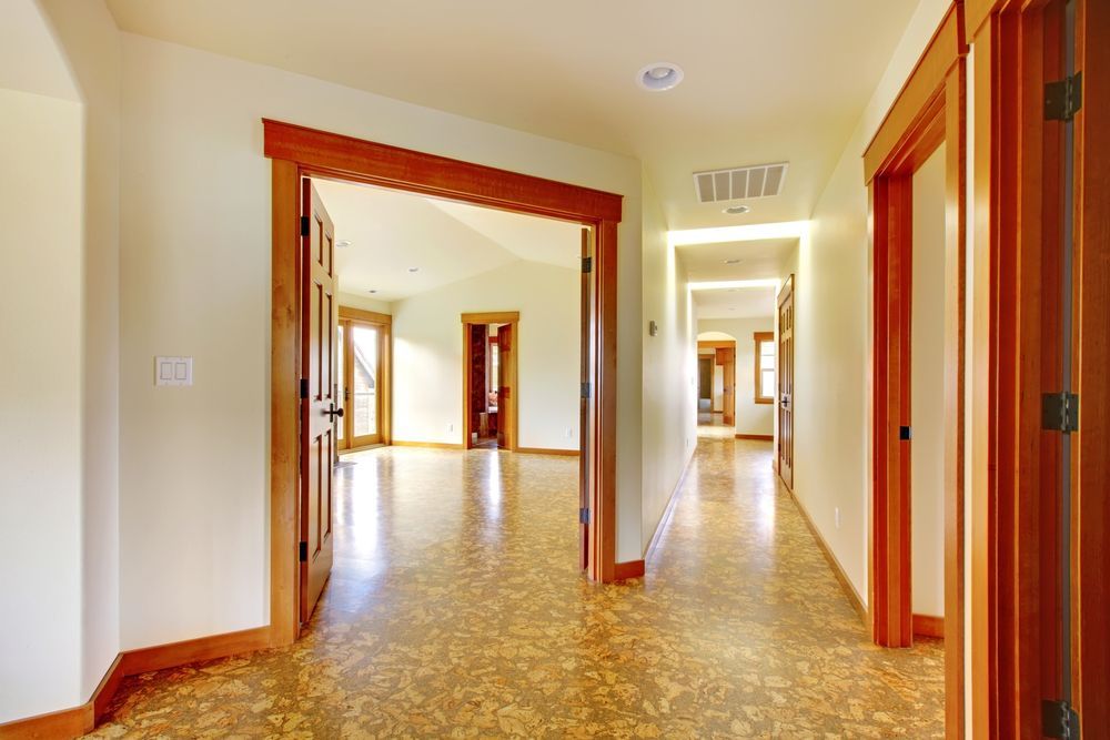 Empty Hallway With Wood Trim, Patterned Floor — Charmhaven Carpets In Charmhaven, NSW